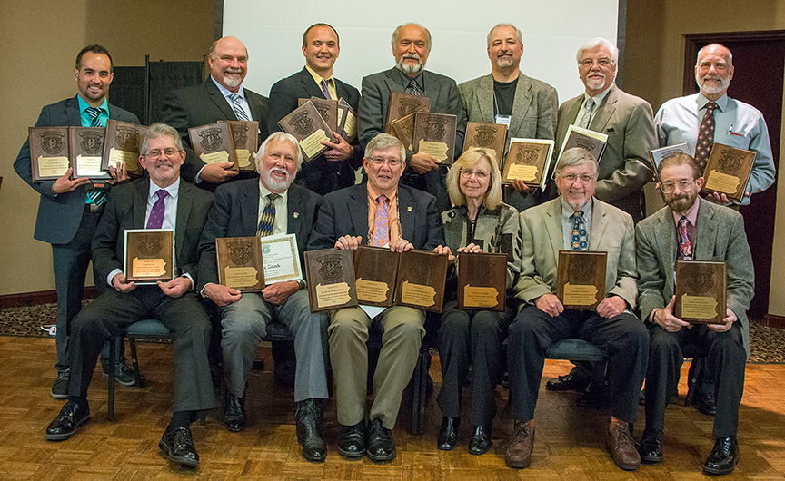 POWA Excellence in Craft Award winners presented at the Spring Conference banquet on May 14 were: front, from left – Tom Tatum, Alex Zidock, Charlie Burchfield, Linda Steiner, Bob Steiner and Wade Robertson; Back – Tyler Frantz, Gerald Putt, Marshall Nych, Ben Moyer, Bob Frye, Tim Flanigan and Mark Nale. Not pictured are Michael Huff and Joe McDonald.